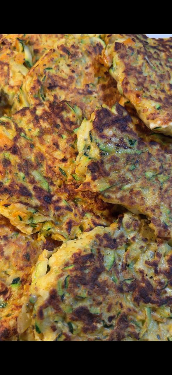 Crispy zucchini and carrot fritters texture close up